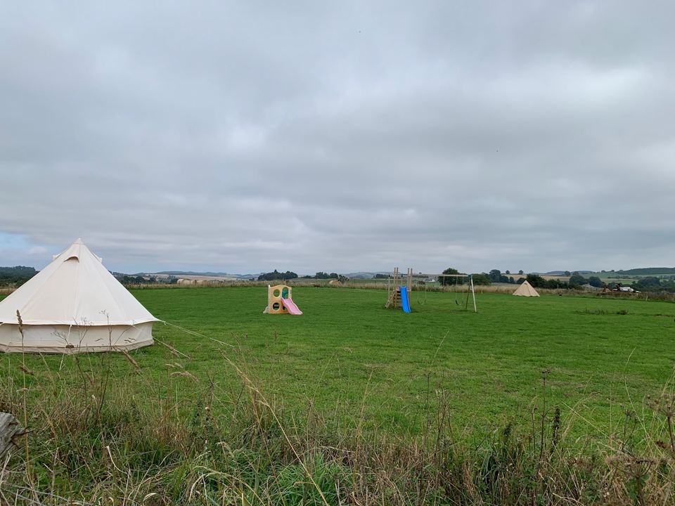 Bell tent beside the camping field