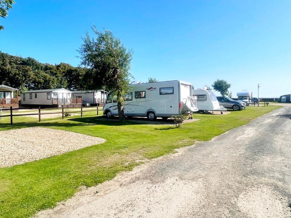 Pitch beside holiday homes