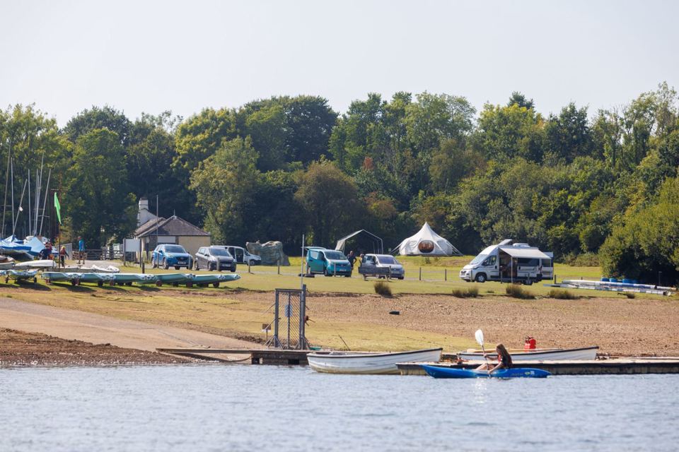 Lakeshore with pitches and boats
