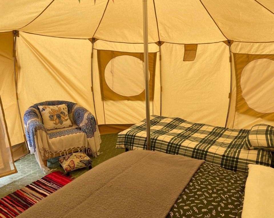 Bell tent interior with armchair