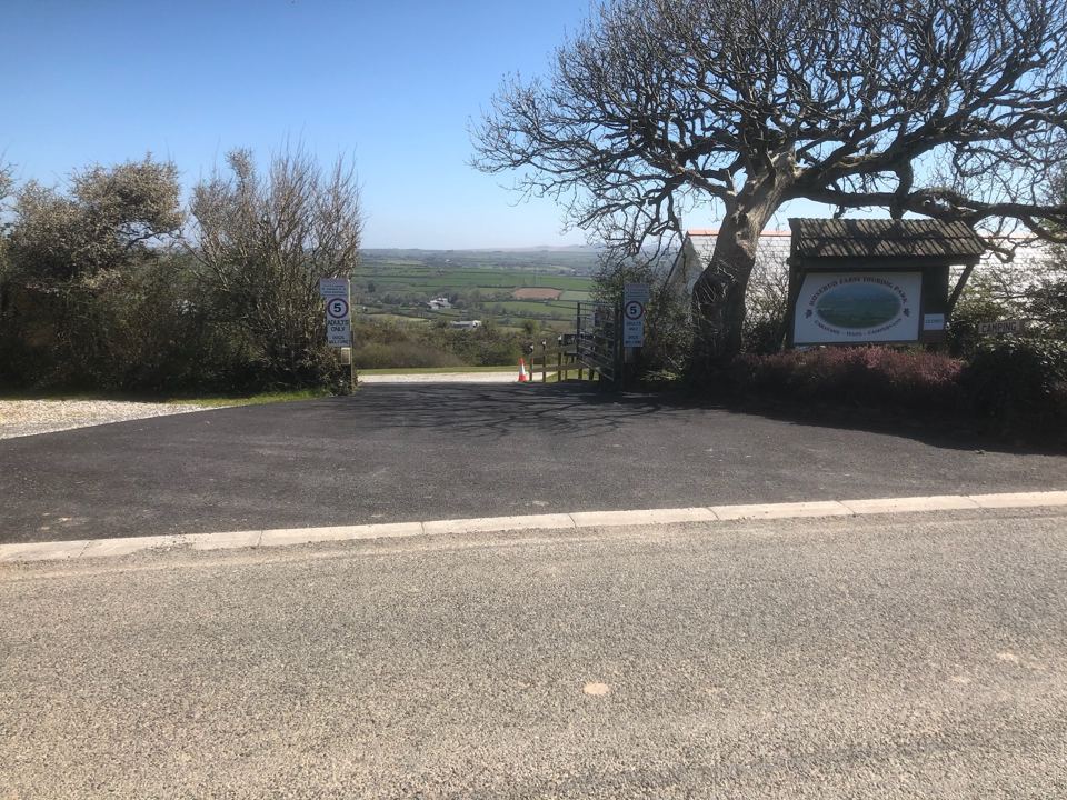 Entrance with signs and tree