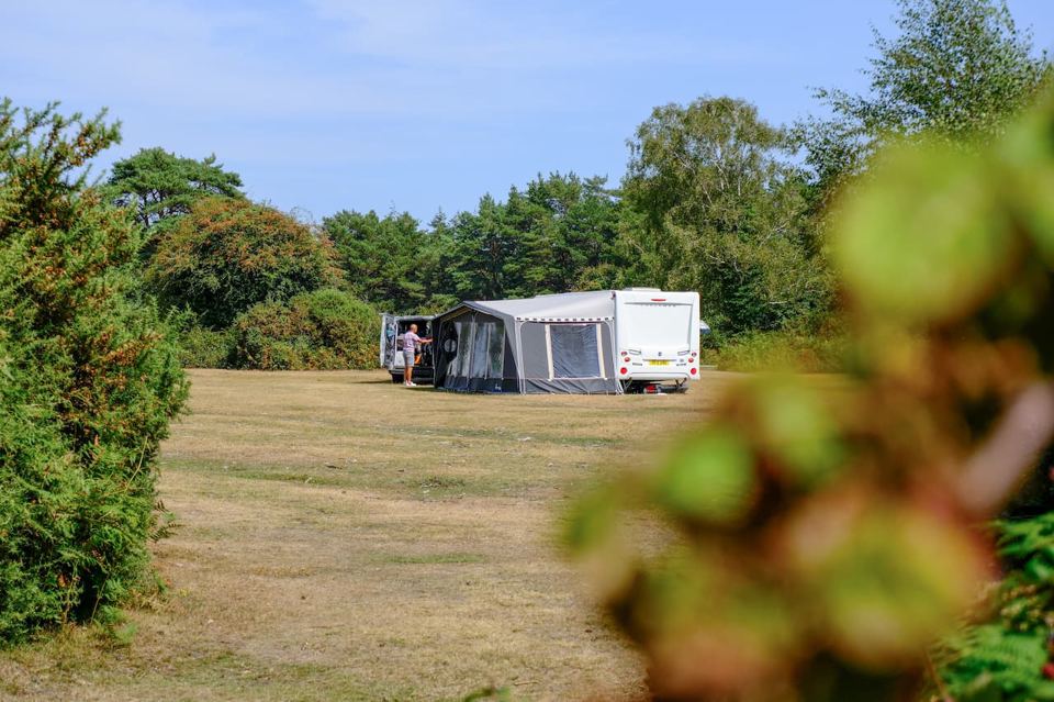 Caravan and awning on open grass