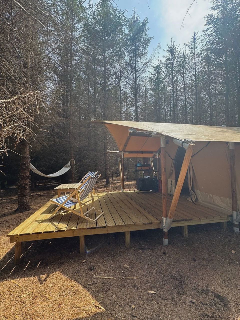 Safari tent with covered deck