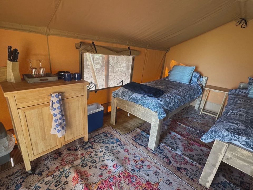 Beds and kitchen cupboard inside