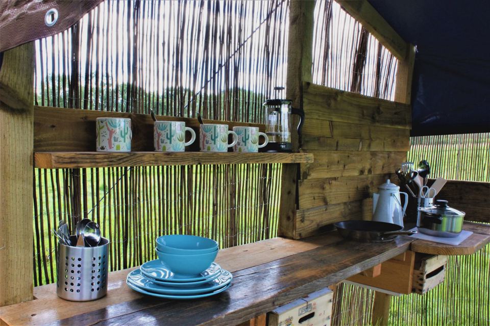 Camp kitchen with crockery