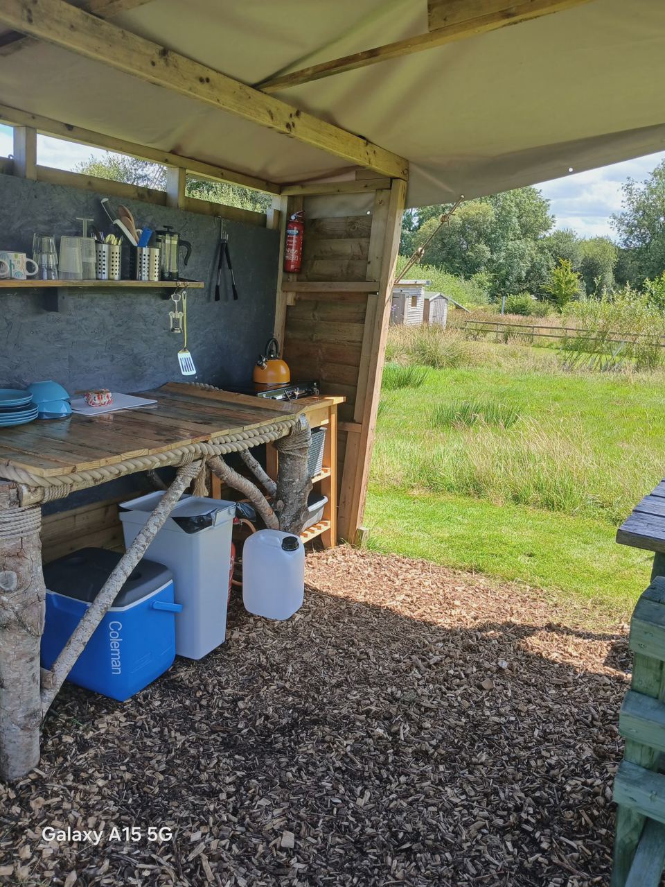 Outdoor kitchen under canvas