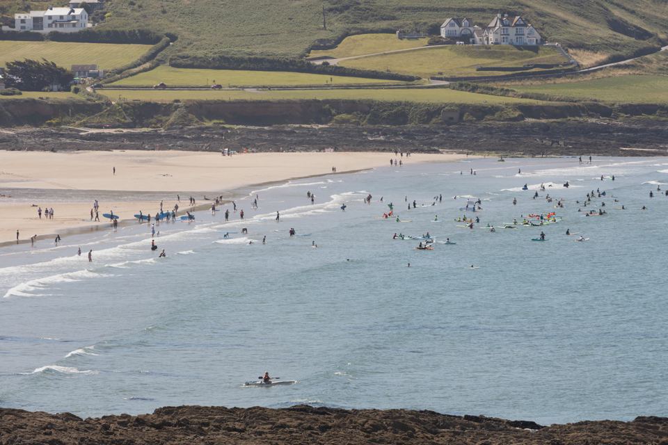 Beach with swimmers and the headland