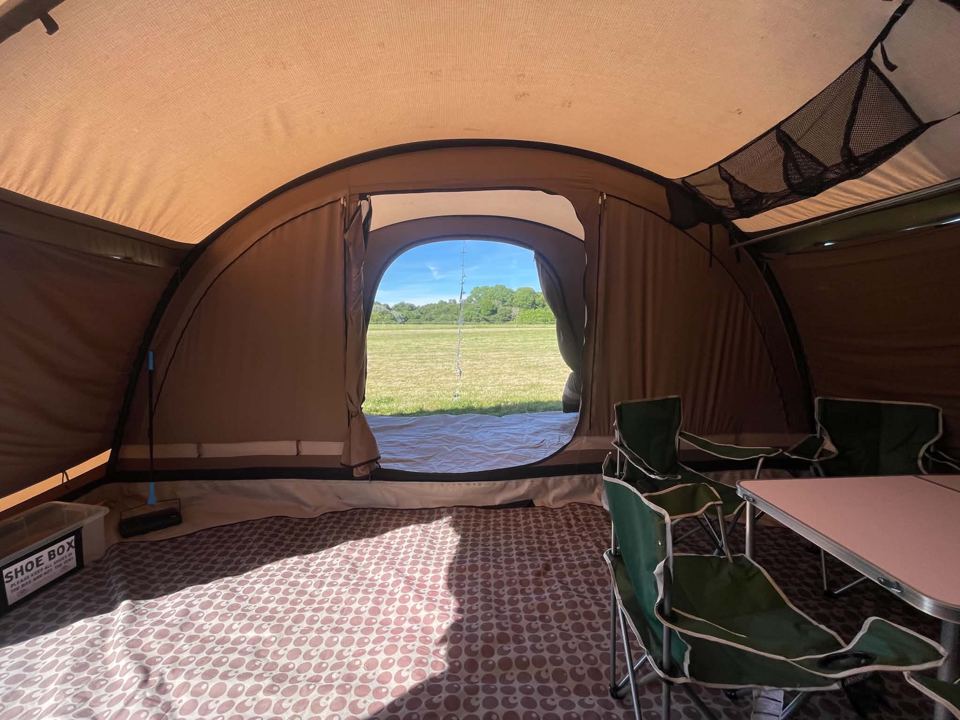 Tent living area with meadow view