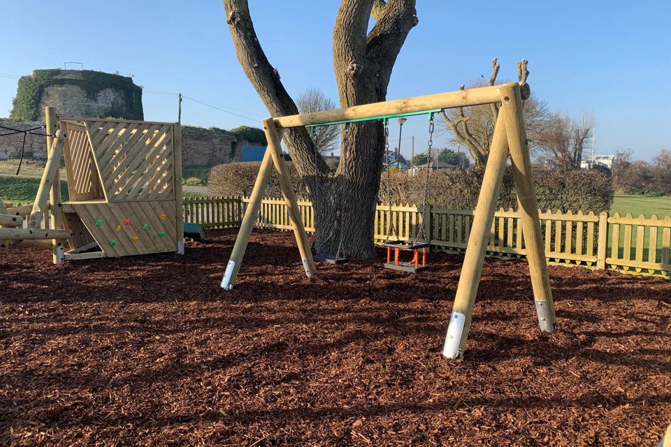 Swings and wooden play frame