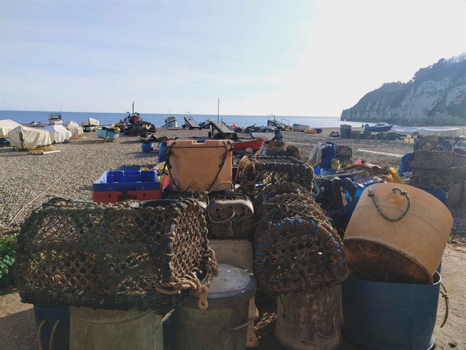 Beach with boats and lobster pots
