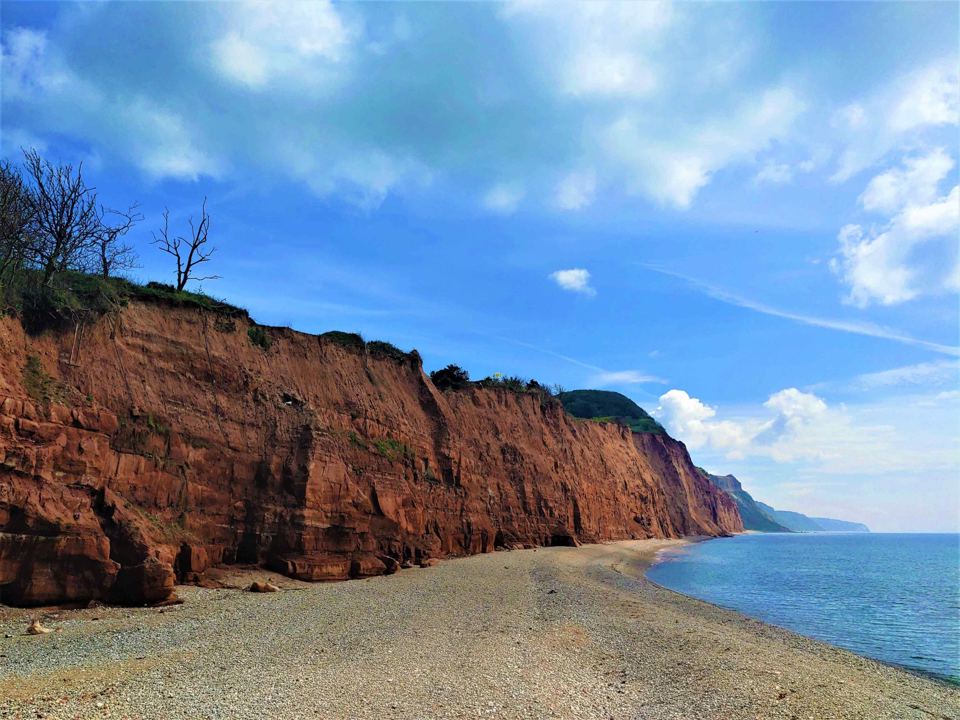 Red cliffs above the shingle beach