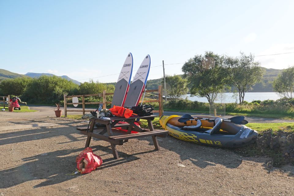 Kayaks and paddleboards by the shore