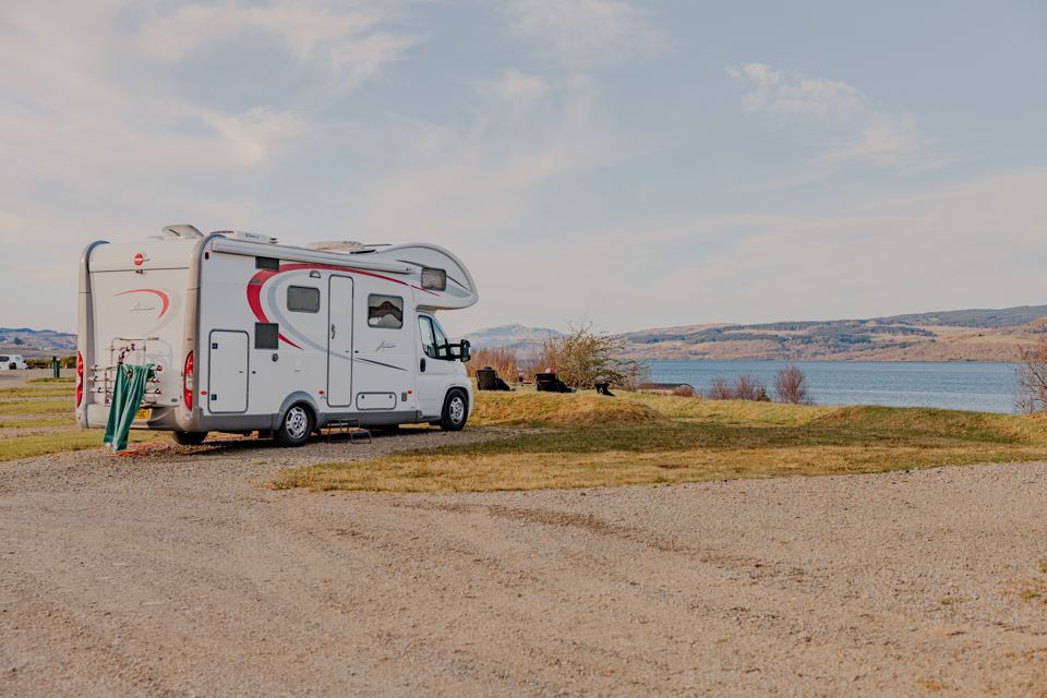 Motorhome on gravel by the water