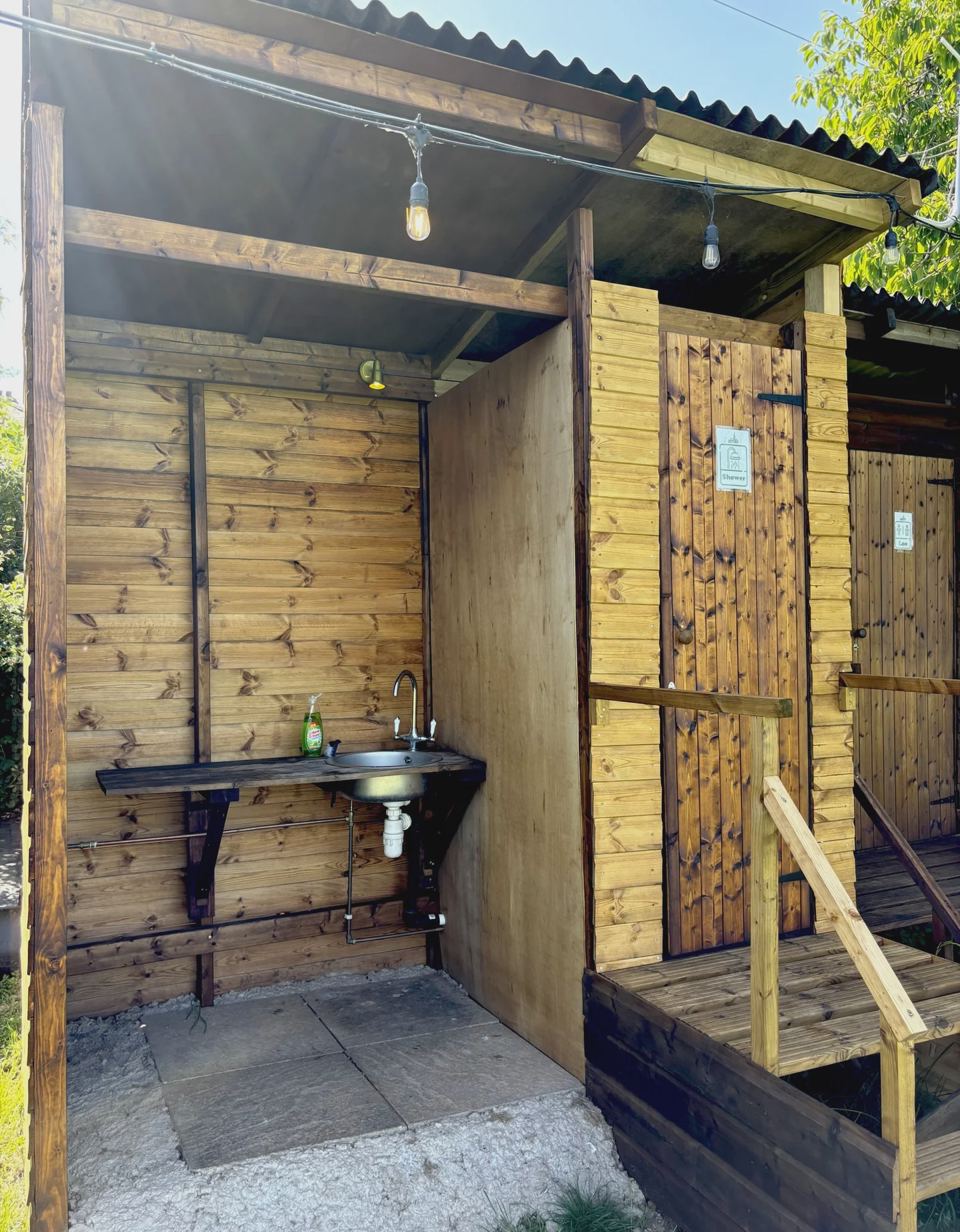Wooden shower block with basin