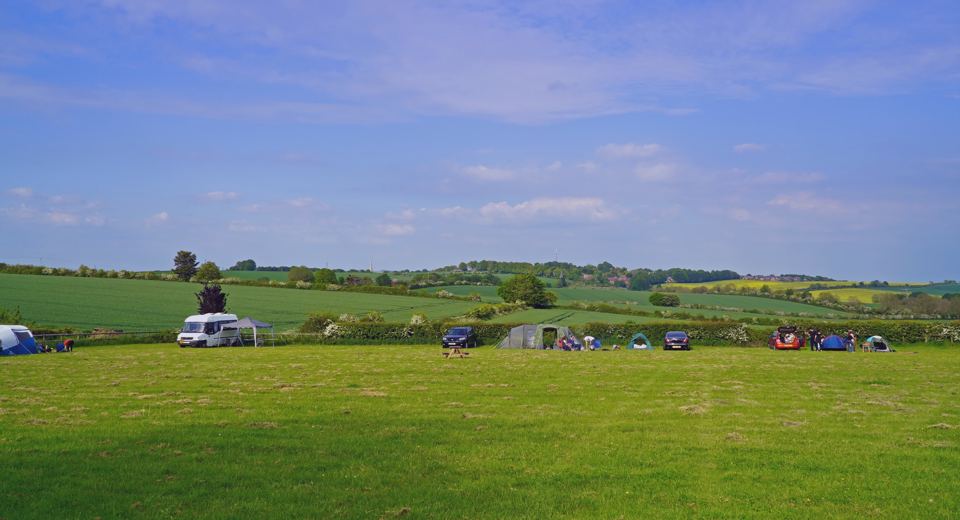 Campervan and tents on the field