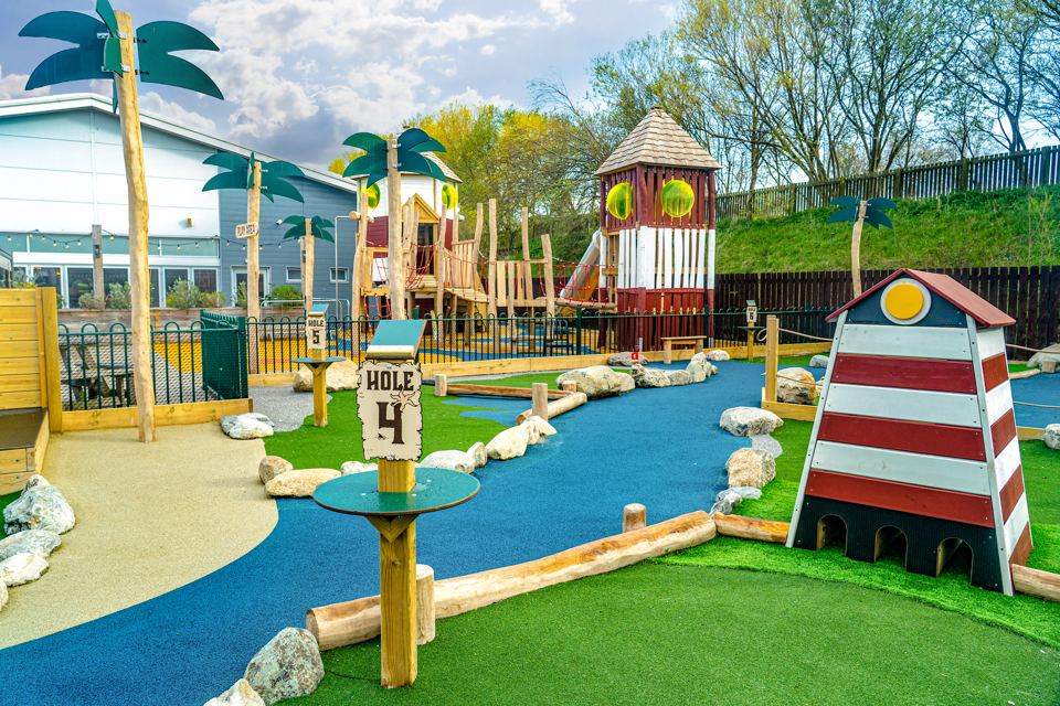 Crazy golf and play tower