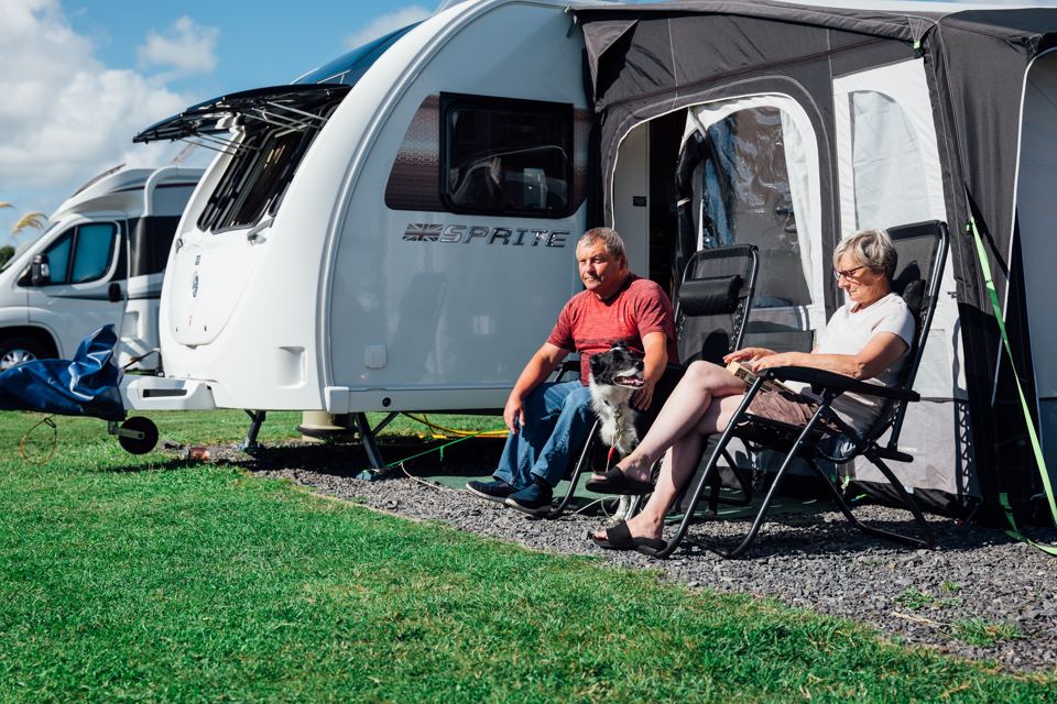 Caravan with awning on gravel pitch