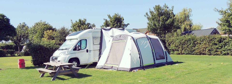 Motorhome with awning on grass