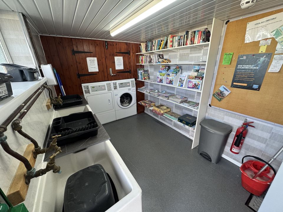 Laundry room with books