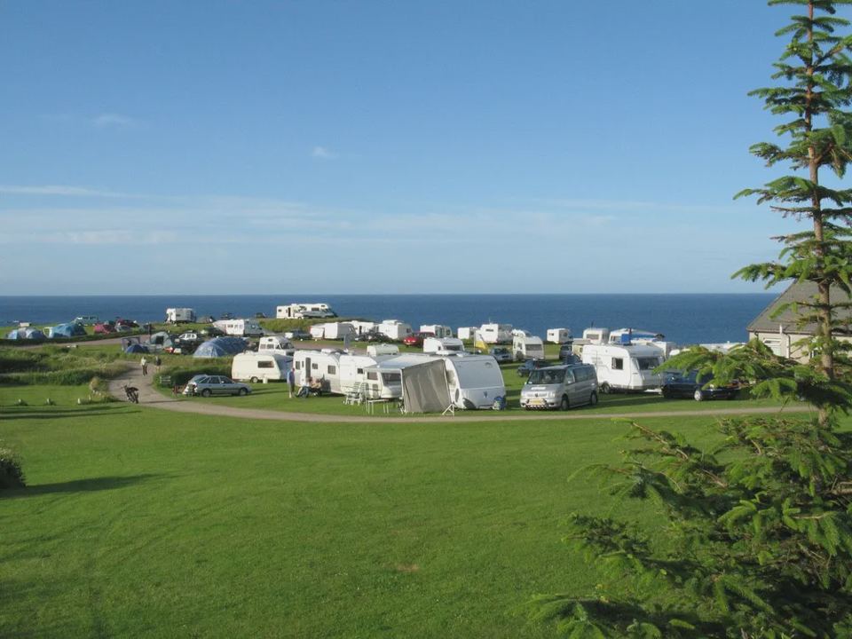 Touring pitches above the bay