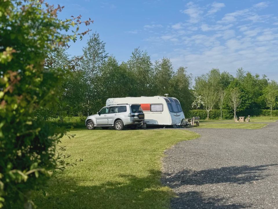 Caravan and car on pitch