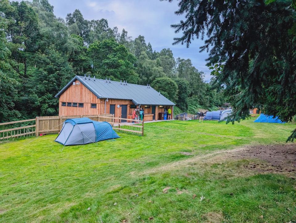 Facilities building beside the tent field