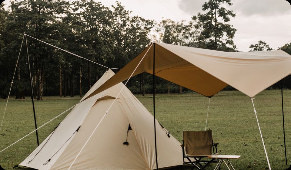 Tent with awning in the field