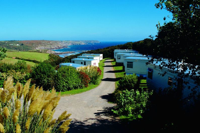Caravans on the hillside above the bay