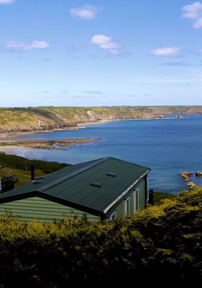 Cove seen past the caravan roofs