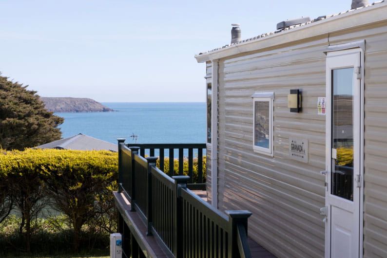 Caravan with decking and sea view