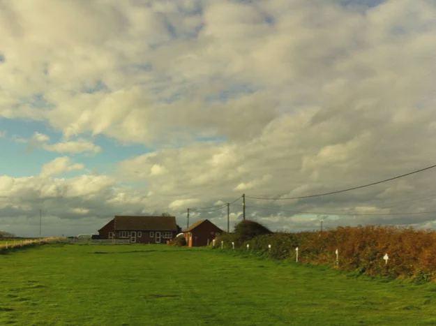 Open grass field and washroom