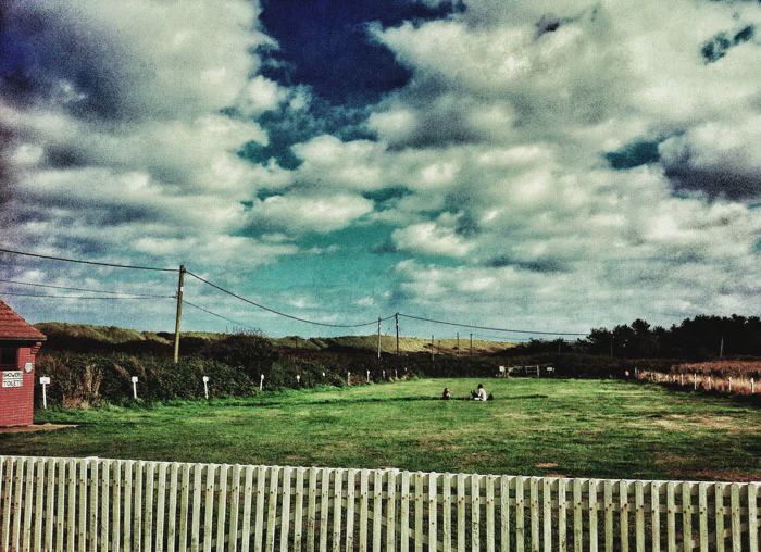 Camping field with picket fence