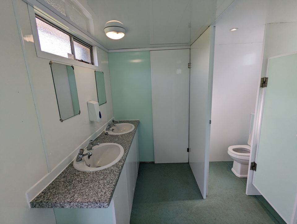 Shower room with sinks and toilet