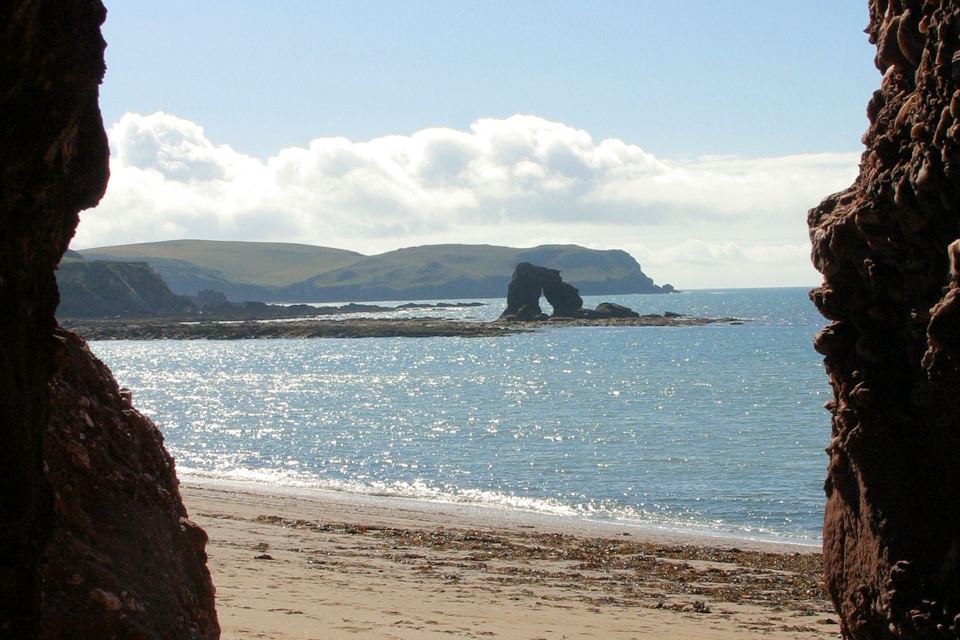 Beach through the rock arch