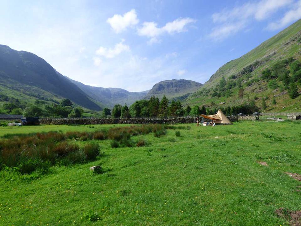 Field and valley with tent