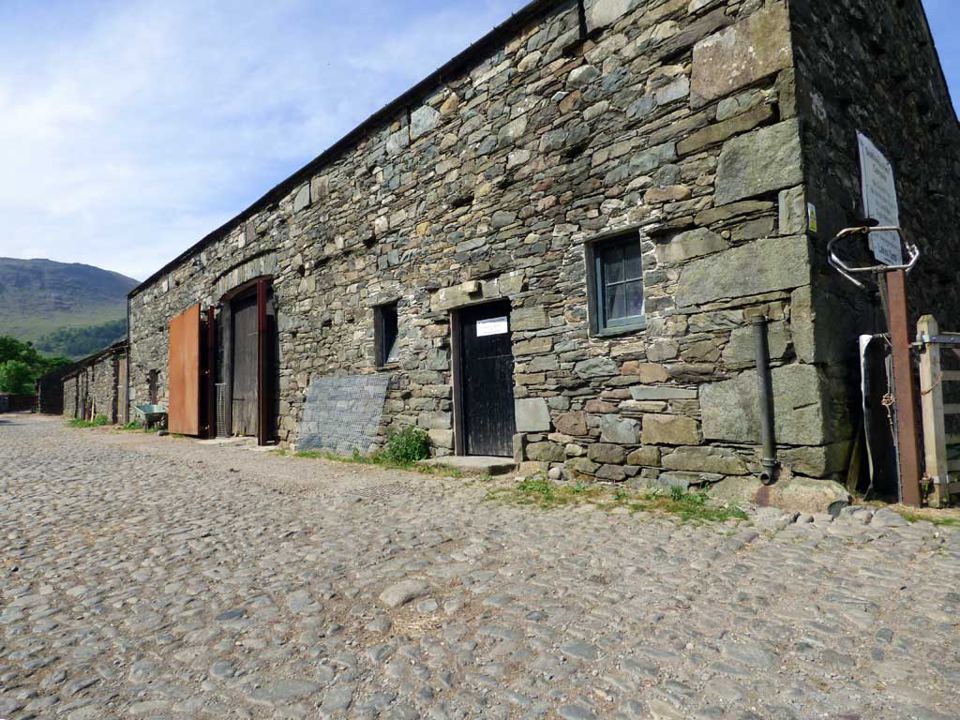 Stone barn beside the cobbled yard