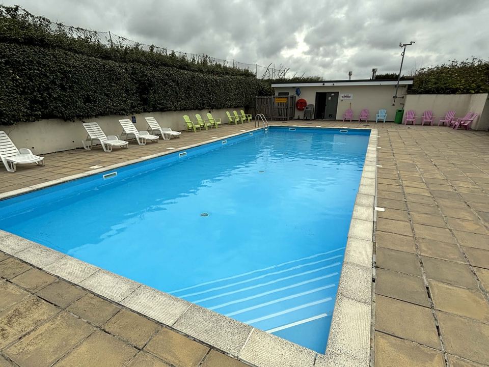 Outdoor pool with loungers