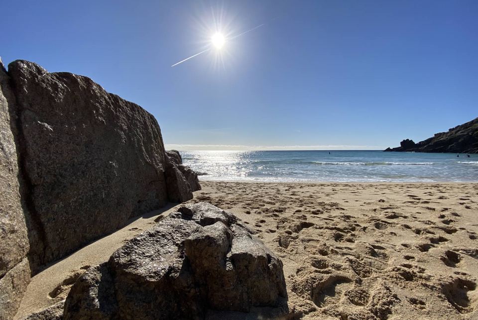 Rock and sand beside the sea