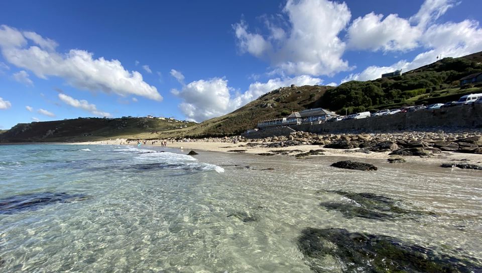 Cove beach with houses above