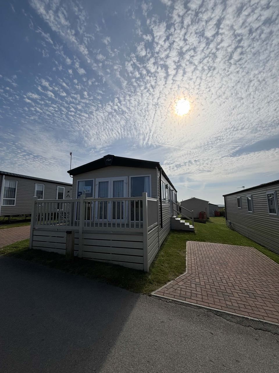 Static caravan under blue sky