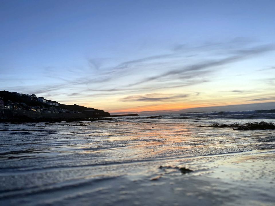 Sunset over the rocks and sea
