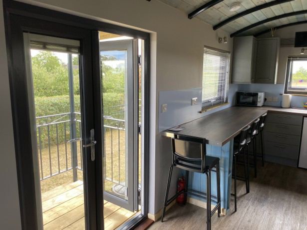 Hut kitchen with balcony doors