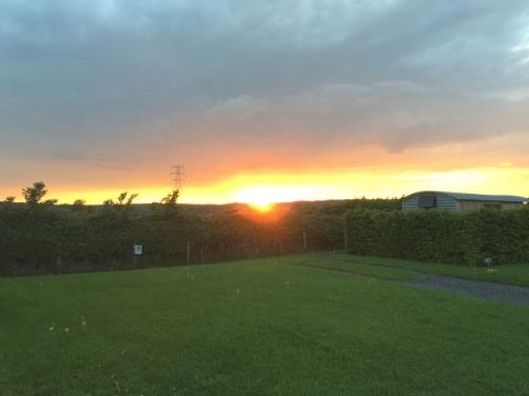 Sunset over the pitch field