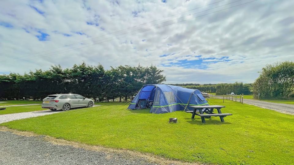 Tent pitch beside a picnic table