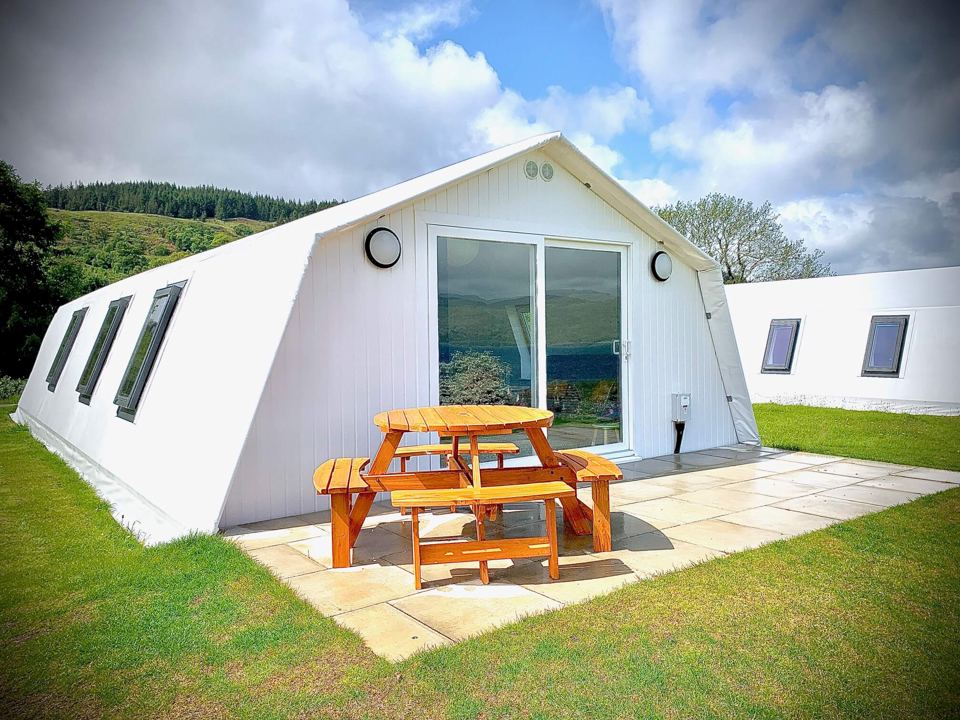 Glamping chalet with picnic table