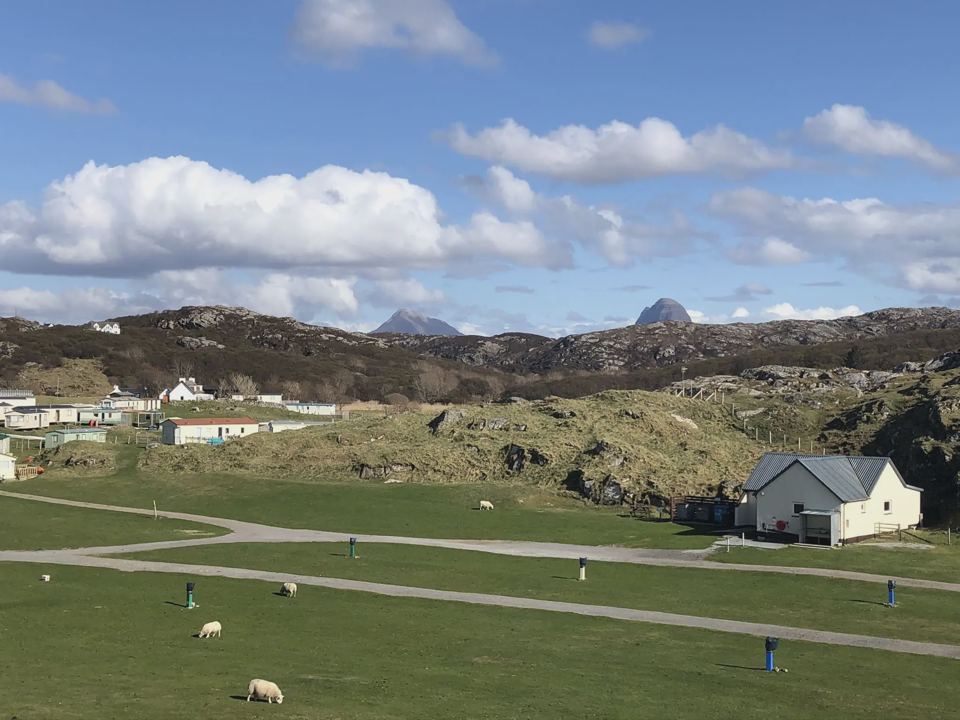 Site grounds with mountains behind