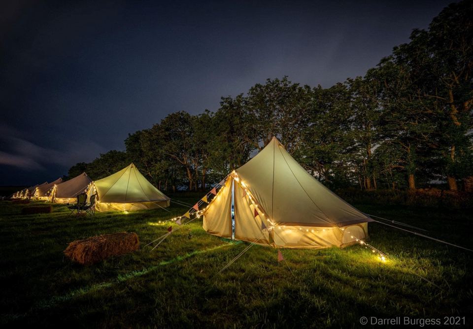 Lit bell tents at night