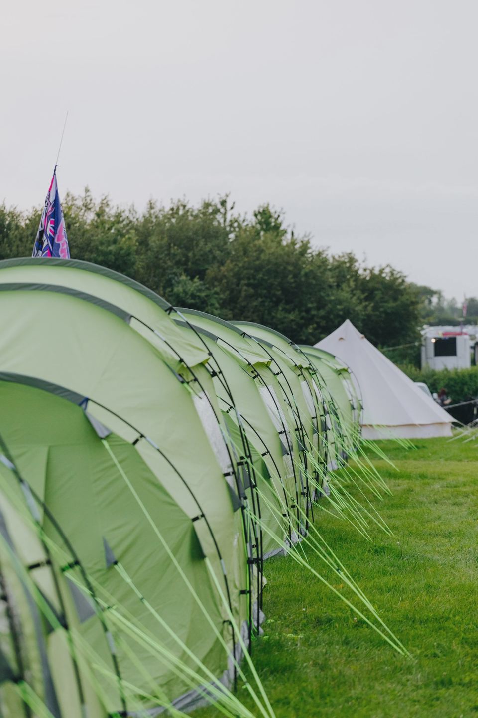 Row of tents on grass