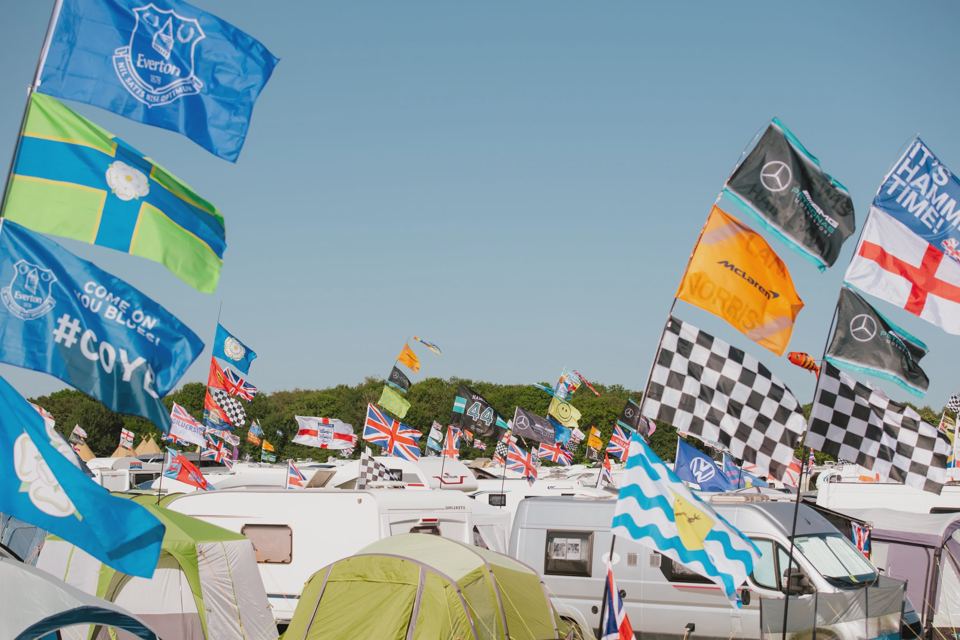 Flags over caravans and tents