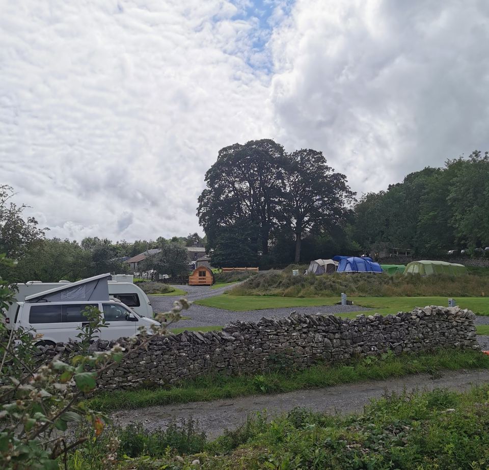 Caravans and tents under trees